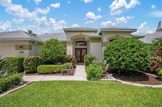 view of front of home featuring a garage and a front yard