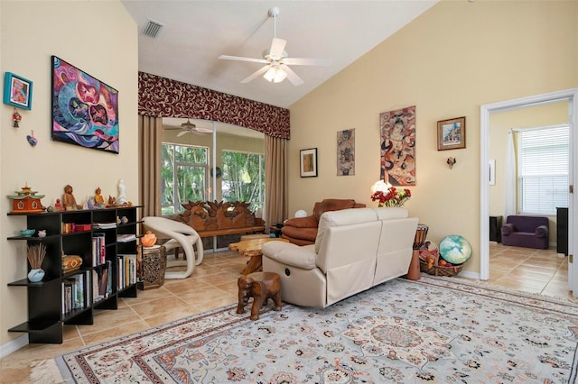 living room with ceiling fan and vaulted ceiling