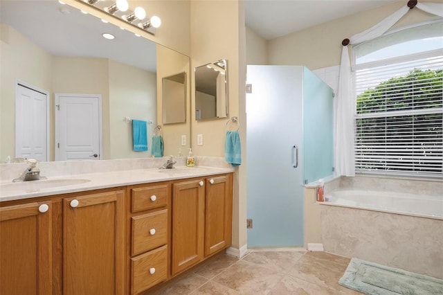 bathroom featuring vanity and shower with separate bathtub