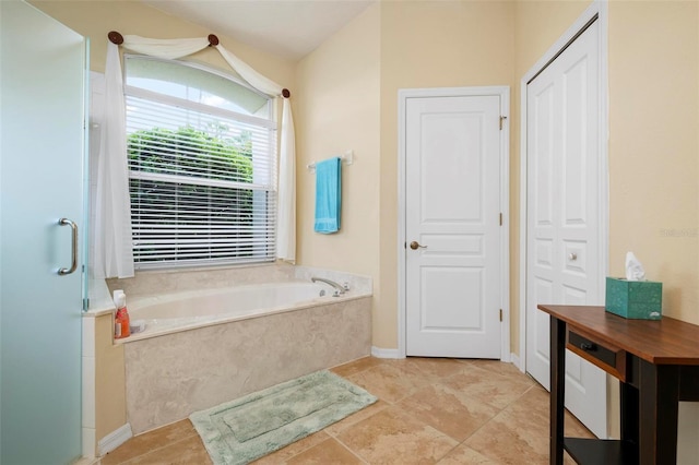 bathroom featuring shower with separate bathtub