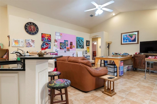 living room with vaulted ceiling, sink, and ceiling fan