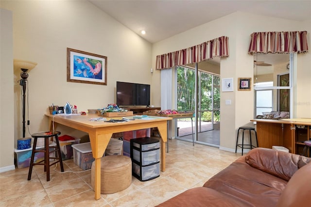 tiled office space featuring vaulted ceiling