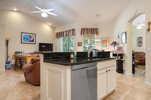 kitchen featuring white cabinetry, a center island, vaulted ceiling, stainless steel dishwasher, and ceiling fan