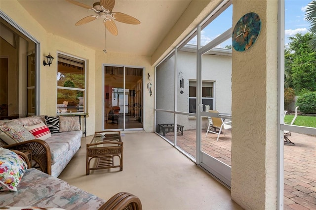 sunroom with ceiling fan