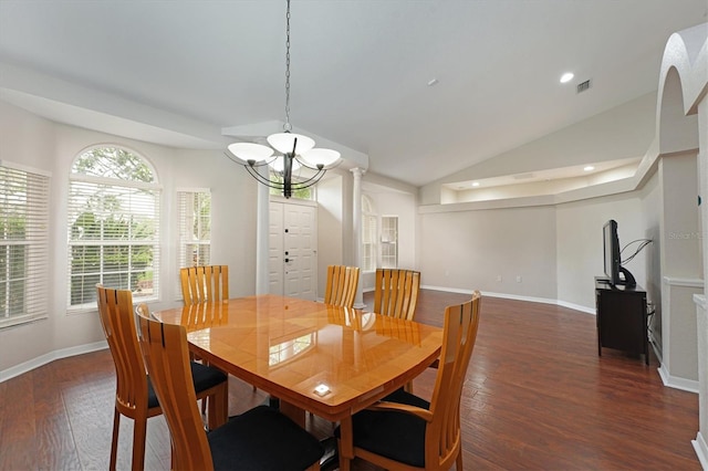 dining room featuring a notable chandelier, dark hardwood / wood-style floors, and vaulted ceiling