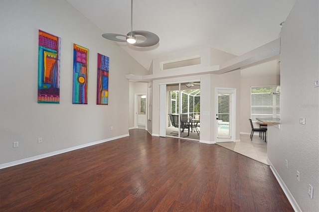 spare room featuring ceiling fan, plenty of natural light, and hardwood / wood-style floors