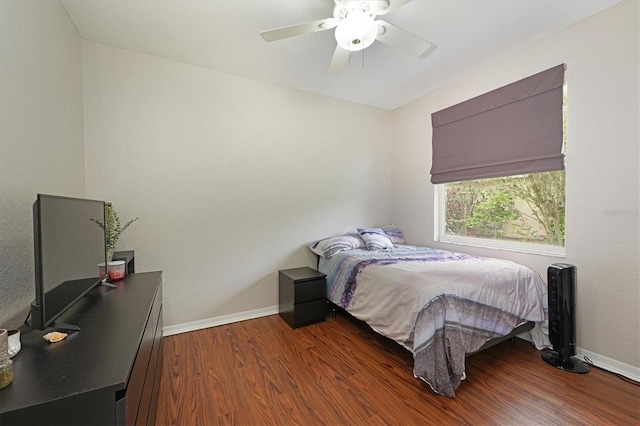 bedroom with hardwood / wood-style flooring and ceiling fan