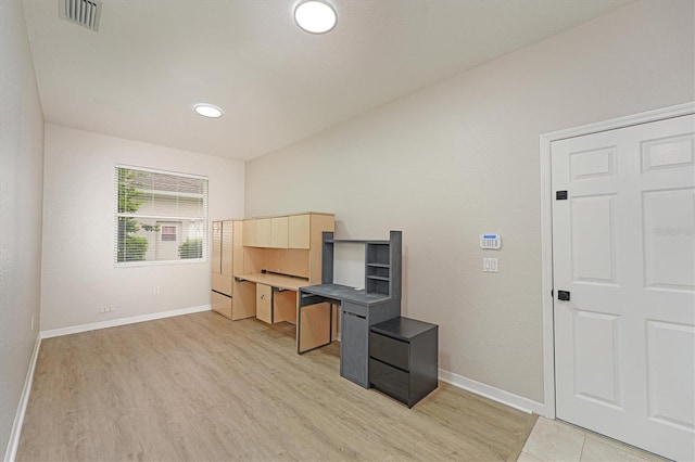 office with light hardwood / wood-style floors