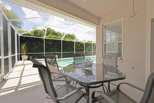 view of patio / terrace featuring glass enclosure