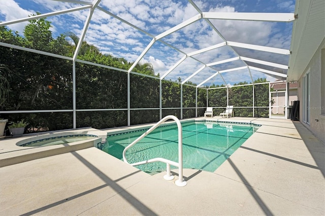 view of swimming pool with a lanai, an in ground hot tub, and a patio