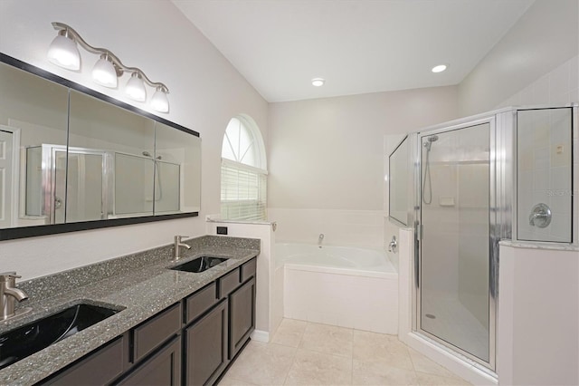 bathroom with tile patterned floors, vanity, and independent shower and bath