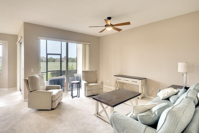 living room with light colored carpet and ceiling fan