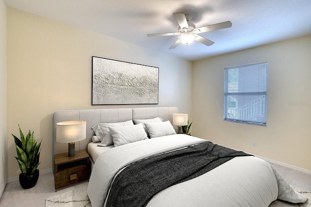 bedroom with light carpet and ceiling fan