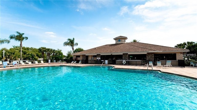 view of swimming pool with a patio area