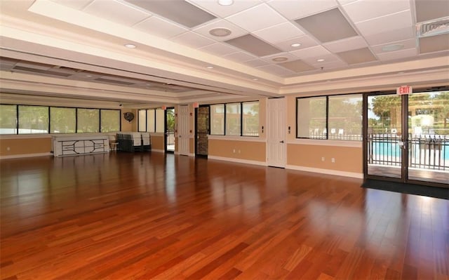 interior space featuring hardwood / wood-style flooring, french doors, and a tray ceiling