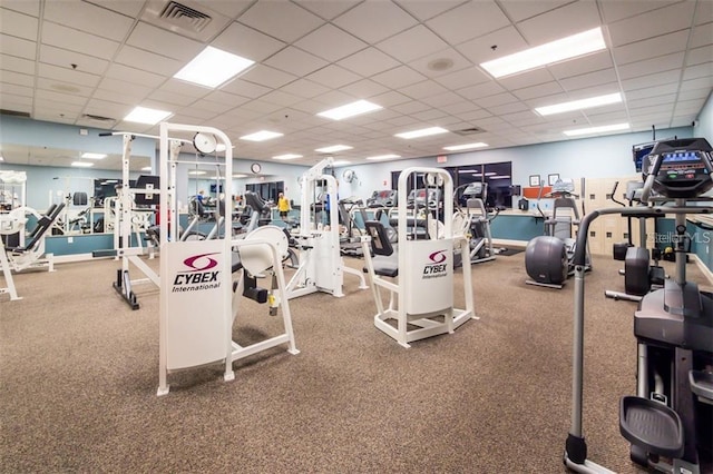 gym featuring a paneled ceiling