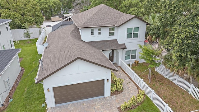 view of front of home featuring a garage and a front yard