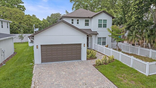 view of front of property with a garage and a front yard