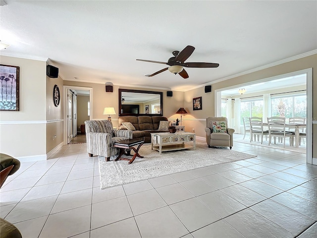 tiled living room with ceiling fan and ornamental molding