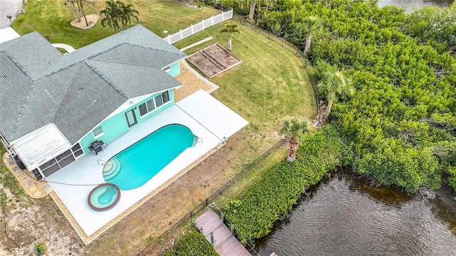 birds eye view of property with a water view