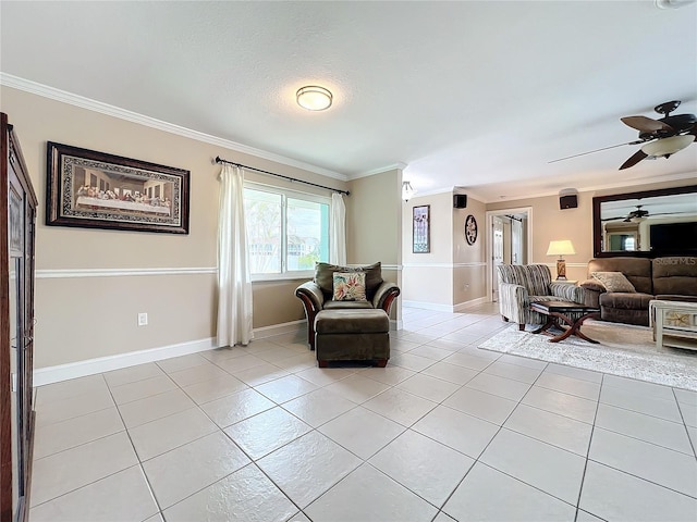 living area featuring ceiling fan, light tile patterned floors, and ornamental molding