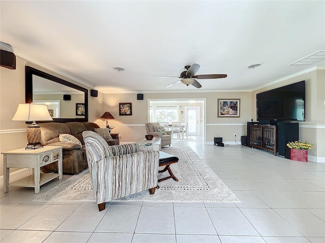 tiled living room featuring ceiling fan and ornamental molding