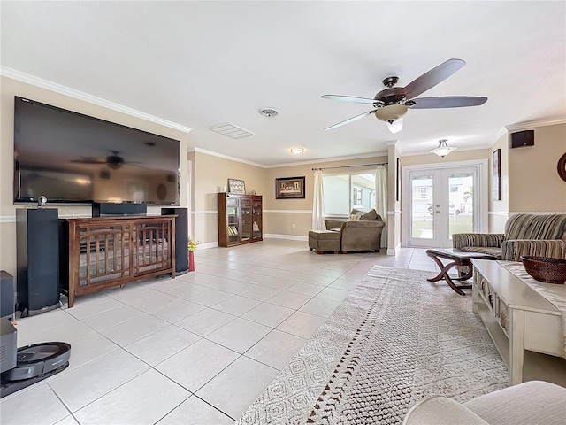 living room featuring ceiling fan, french doors, light tile patterned flooring, and ornamental molding