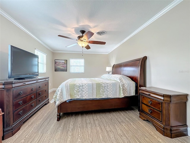 bedroom with a textured ceiling, ceiling fan, ornamental molding, and light hardwood / wood-style floors