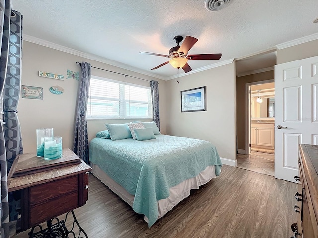 bedroom with ceiling fan, dark hardwood / wood-style flooring, crown molding, and a textured ceiling