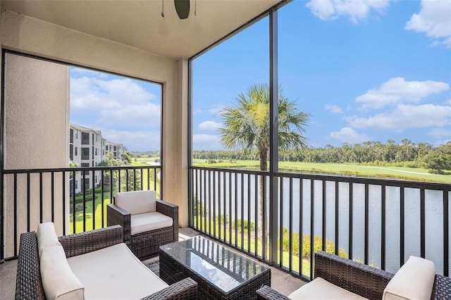 sunroom / solarium with a water view