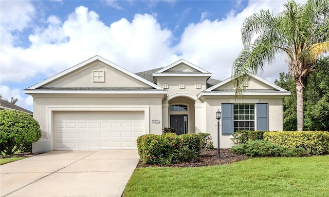 ranch-style home with a front yard and a garage