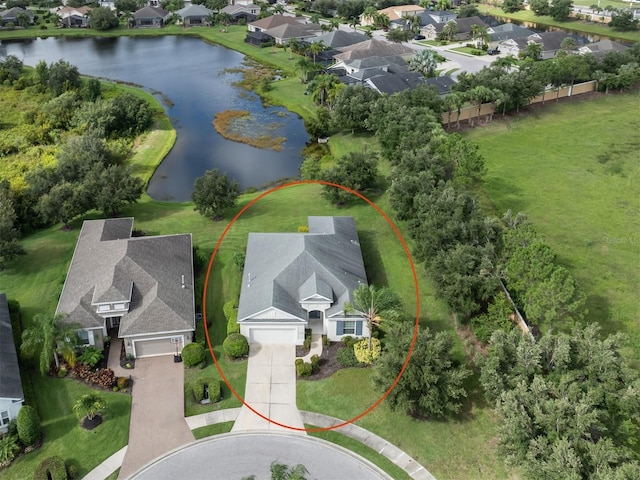 bird's eye view featuring a water view and a residential view