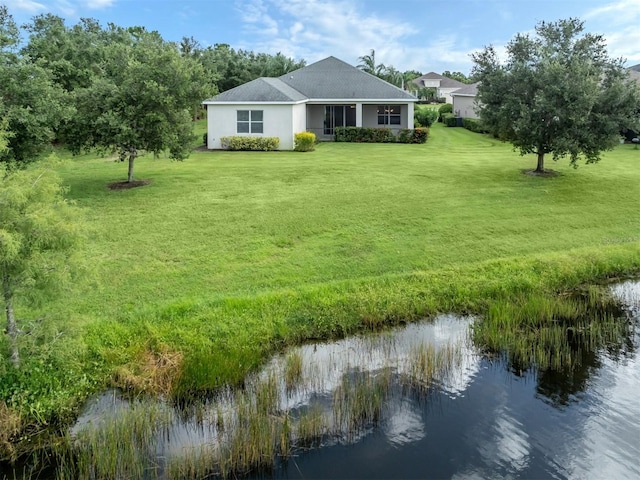 exterior space with a water view