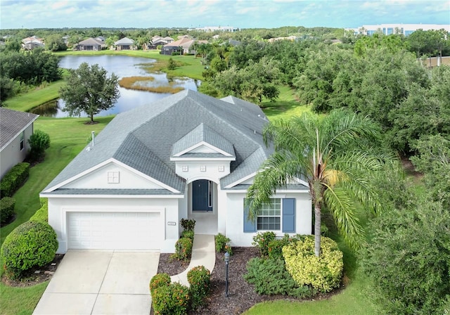 birds eye view of property with a water view