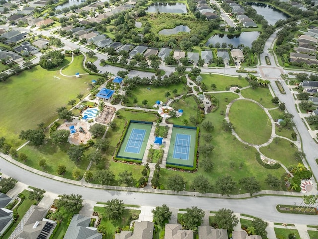 bird's eye view with a water view and a residential view