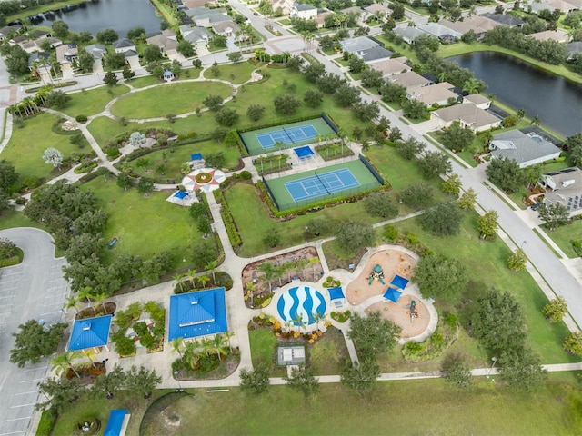 bird's eye view with a water view and a residential view