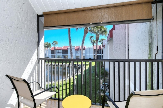 balcony featuring a water view