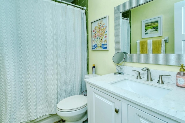 full bath featuring toilet and vanity