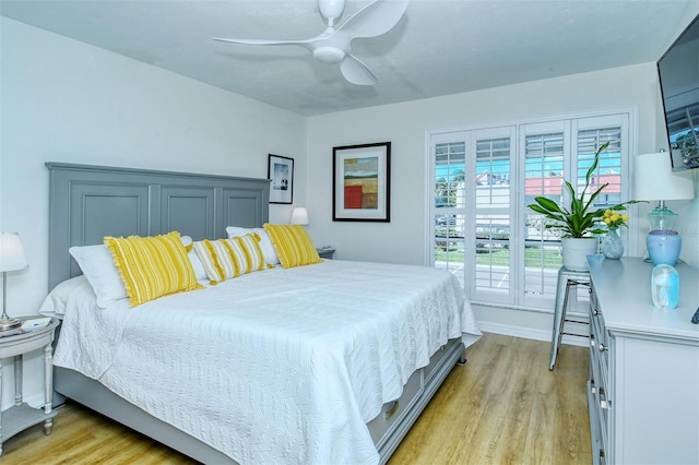 bedroom with light wood-style floors and a ceiling fan