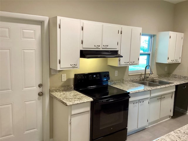 kitchen featuring black appliances, white cabinetry, and sink