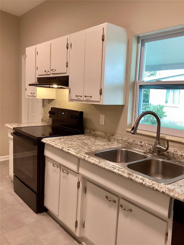 kitchen with sink, black range with electric stovetop, and white cabinets