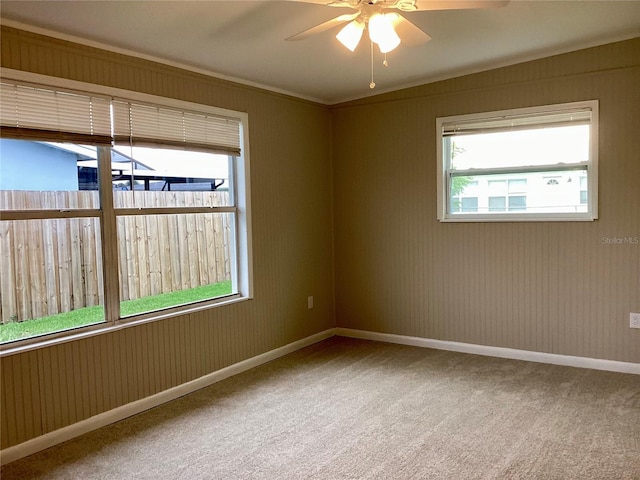 carpeted empty room with ceiling fan