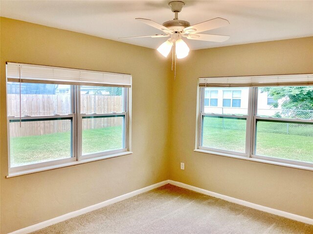 carpeted empty room with ceiling fan