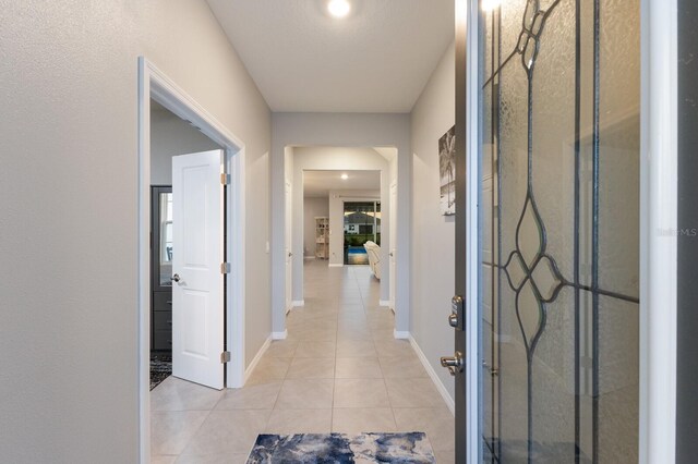 entrance foyer with light tile patterned flooring