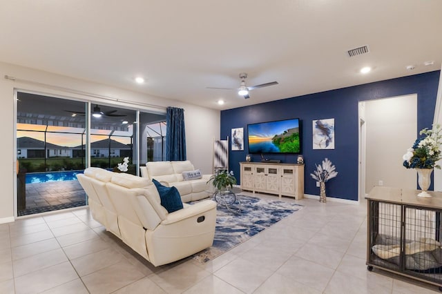 tiled living room with ceiling fan