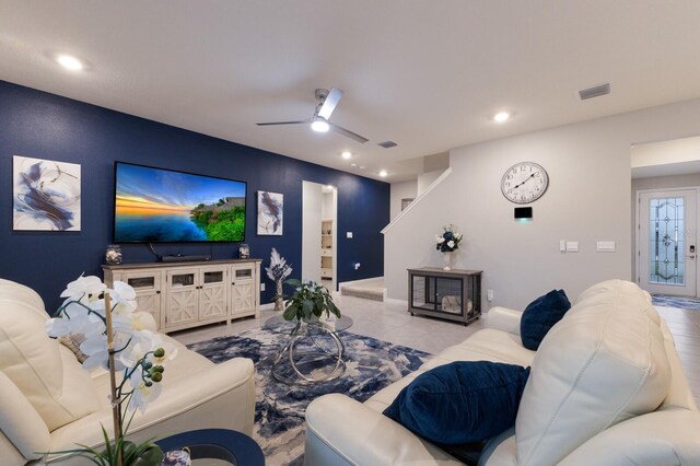 living room with light tile patterned flooring and ceiling fan