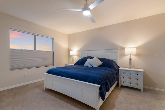 bedroom with light colored carpet and ceiling fan