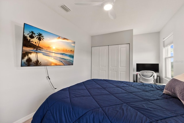 bedroom with ceiling fan and a closet