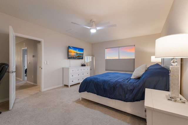 bedroom featuring light carpet and ceiling fan