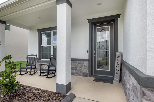 doorway to property with covered porch